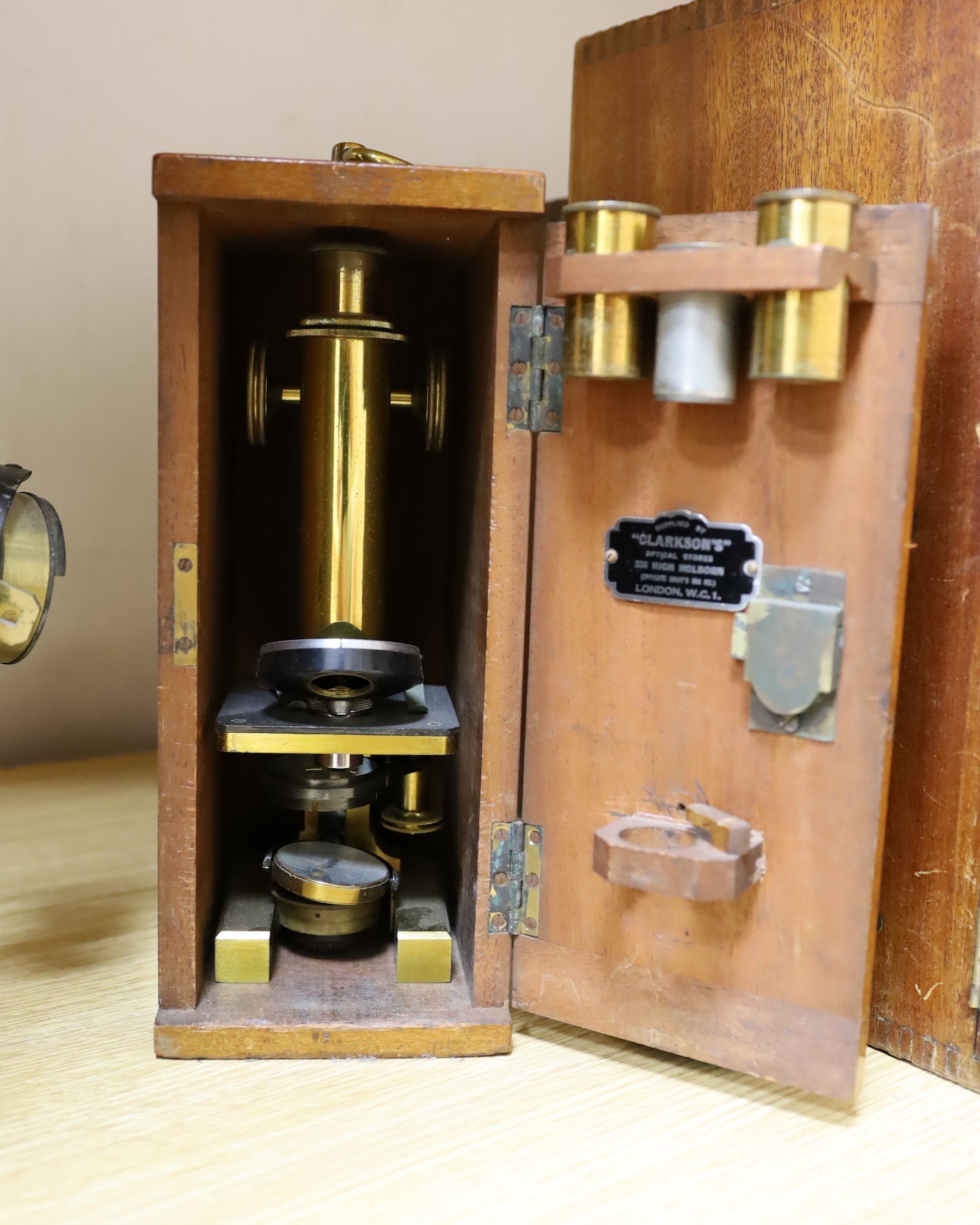 Five cased microscopes, another uncased and a pine microscope slide cabinet, latter 25.5 cm height